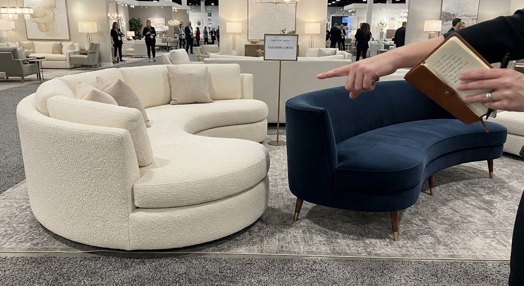 Curved Sofa Showroom Comparison Comparison of two curved sofas at High Point Market—one built for comfort, one built for photos.